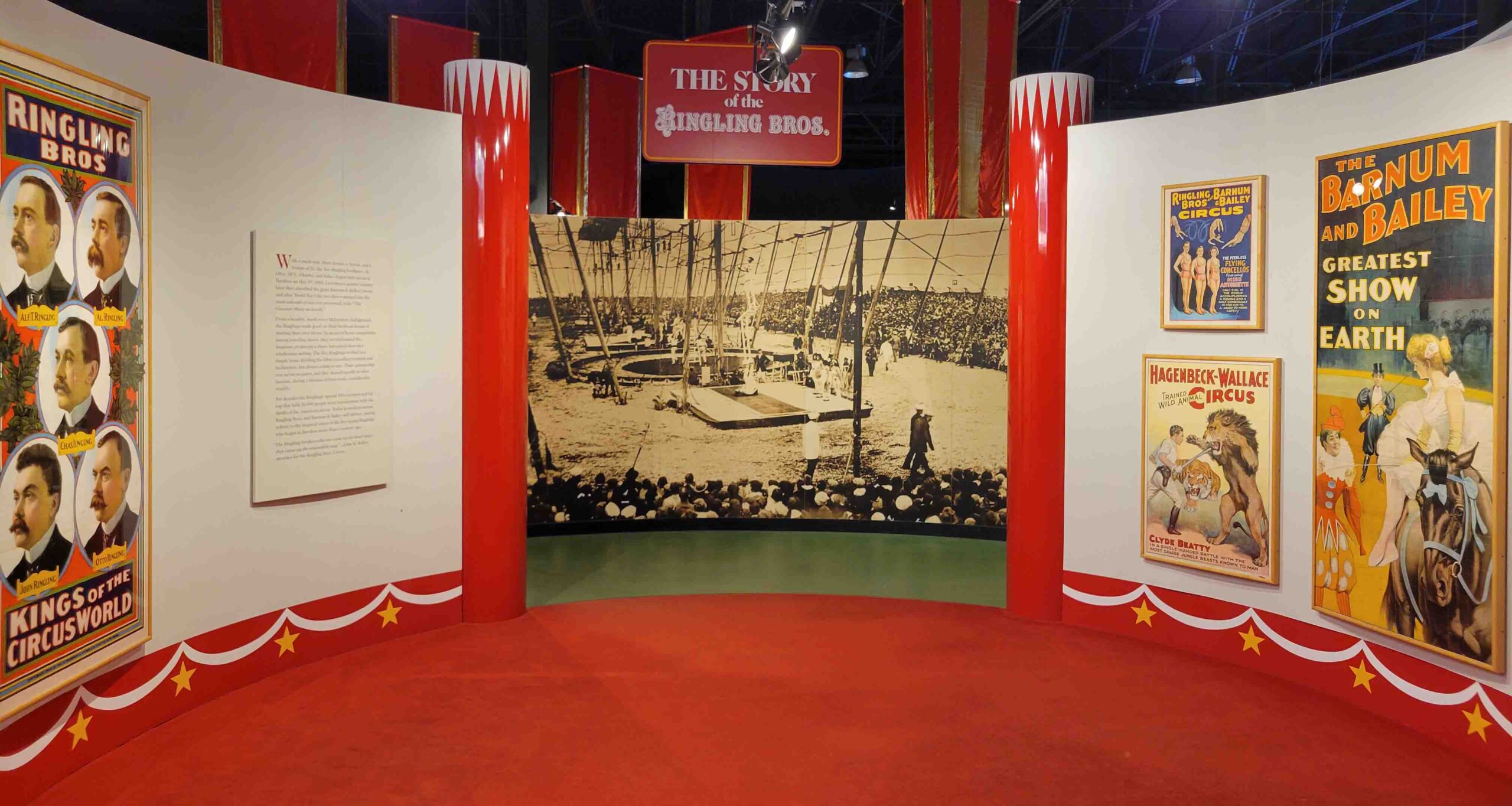 An image of a section of a Circus World exhibit that has old circus posters and images on the wall.