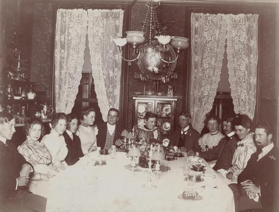 Mrs. Nina Dousman with children and house party guests in the dining room at Villa Louis.